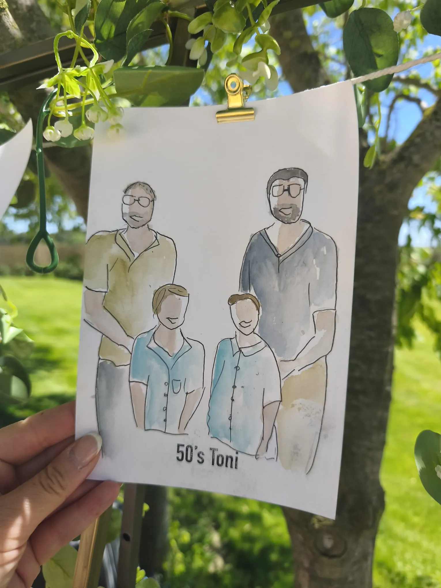 Retrat en aquarel·la d’una família de quatre fet en directe